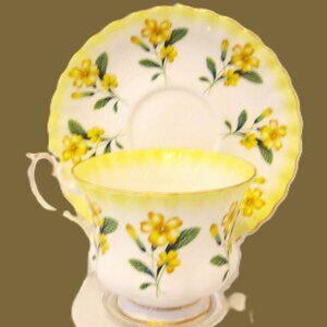 Royal Albert Yellow Primrose pattern with greenery gold edged teacup and saucer